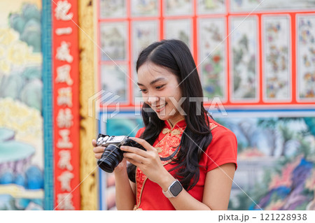 Celebrating chinese new year a tourist's delight in a vibrant cultural setting captivating moments colorful environment 121228938