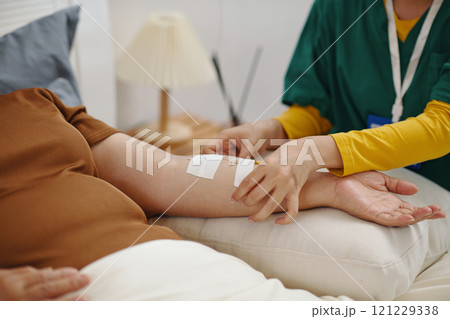 Nurse Putting Intravenous IV Drip Nurse Putting Intravenous IV Drip 121229338