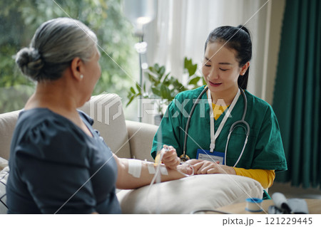 Senior Woman Getting Intravenous Therapy 121229445