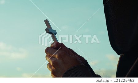 Christian man prays in the early hours of the day 121229462