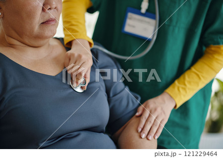 Nurse Listening To Heartbeat Of Senior Patient Nurse Listening To Heartbeat Of Senior Patient 121229464