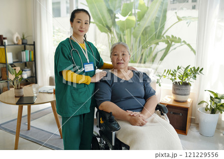 Caregiver With Senior Patient In Wheelchair Caregiver With Senior Patient In Wheelchair 121229556