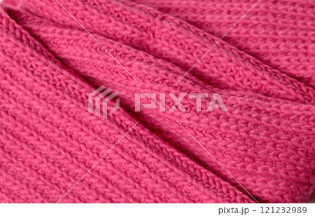 Bright saturated pink background knitted with pattern for design. Textured wool. Abstract backdrop. Bright saturated pink background knitted with pattern for design. Textured wool. Abstract backdrop. 121232989