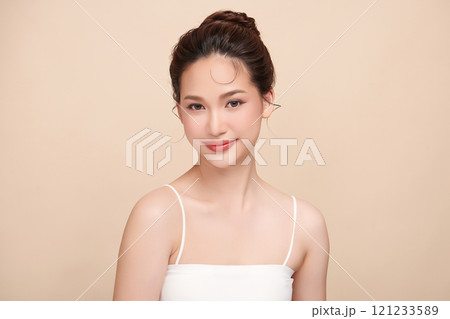 Beautiful young asian woman with clean fresh skin on beige background, Face care, Facial treatment, Cosmetology, beauty and spa, Asian women portrait. Beautiful young asian woman with clean fresh skin on beige background, Face care, Facial treatment, Cosmetology, beauty and spa, Asian women portrait. 121233589