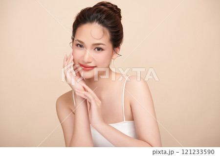 Beautiful young asian woman with clean fresh skin on beige background, Face care, Facial treatment, Cosmetology, beauty and spa, Asian women portrait. 121233590