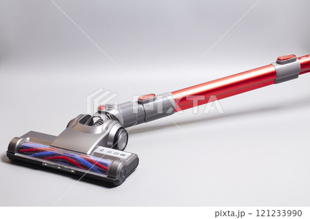 Cordless handheld vacuum cleaner on gray background 121233990