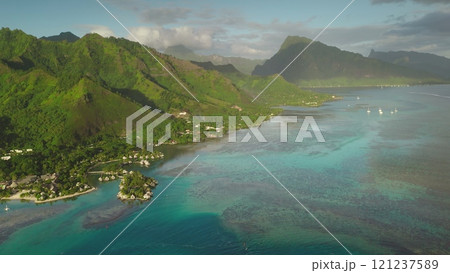 Aerial drone beauty of Moorea tropical island in French Polynesia, showcasing turquoise lagoon, green volcanic mountains, vibrant coral reef. Popular travel destination, remote wild paradise Aerial drone beauty of Moorea tropical island in French Polynesia, showcasing turquoise lagoon, green volcanic mountains, vibrant coral reef. Popular travel destination, remote wild paradise 121237589
