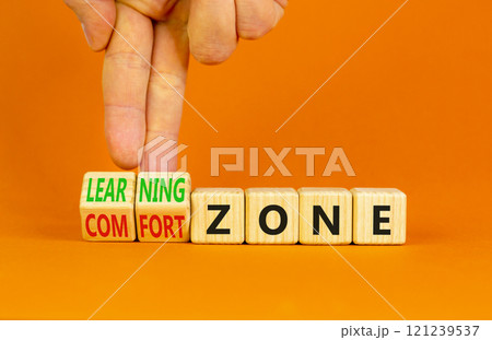 Comfort or learning zone symbol. Concept words Comfort zone Learning zone on wooden cubes. Beautiful orange background. Psychologist hand. Business and comfort or learning zone concept. Copy space. Comfort or learning zone symbol. Concept words Comfort zone Learning zone on wooden cubes. Beautiful orange background. Psychologist hand. Business and comfort or learning zone concept. Copy space. 121239537