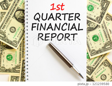 1st quarter financial report symbol. Concept words 1st quarter financial report on beautiful white note. Beautiful dollar background. Business 1st quarter financial report concept. Copy space. 121239580