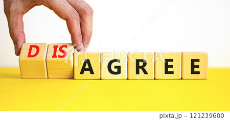 Agree or disagree symbol. Concept words Agree Disagree on beautiful wooden blocks. Beautiful yellow table white background. Businessman hand. Business agree or disagree concept. Copy space 121239600