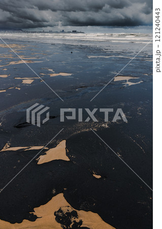 Oil in ocean coastline after a tanker wreck. Oil fuel polluted beach Oil in ocean coastline after a tanker wreck. Oil fuel polluted beach 121240443