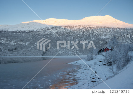 Nature with snow and houses, Gratangsbotn, Norway 121240733