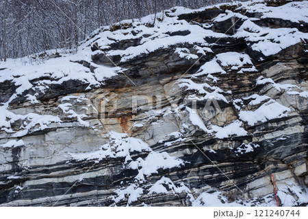 Texture of a stone wall with snow, Norway 121240744