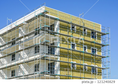 Thermal insulation of the facade of a apartment building with mineral wool plates Thermal insulation of the facade of a apartment building with mineral wool plates 121240829