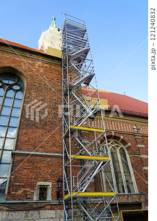 Historic church tower facade restoration using modern very high prefabricated metal tube scaffolding 121240832