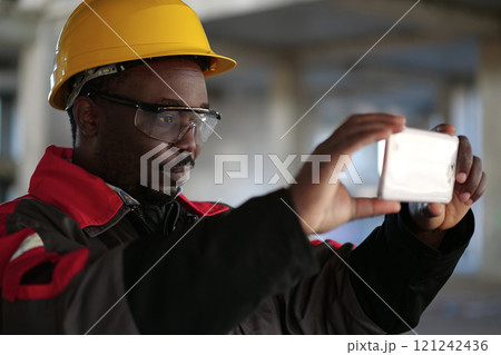 Manager of the works at construction site filming video 121242436