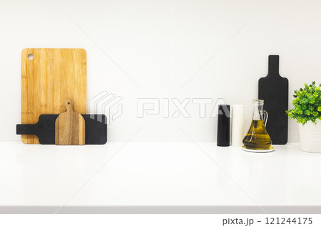 Cutting boards and utensils on white kitchen, mockup Cutting boards and utensils on white kitchen, mockup 121244175