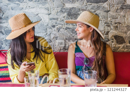 Tourists enjoying traditional ecuadorian meal in madrid restaurant 121244327