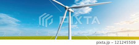A serene landscape featuring wind turbines against a bright blue sky , renewable energy and sustainable 121245509