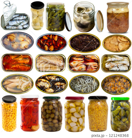 Assorted various canned goods with meat, vegetables and seafood on a white background 121248368
