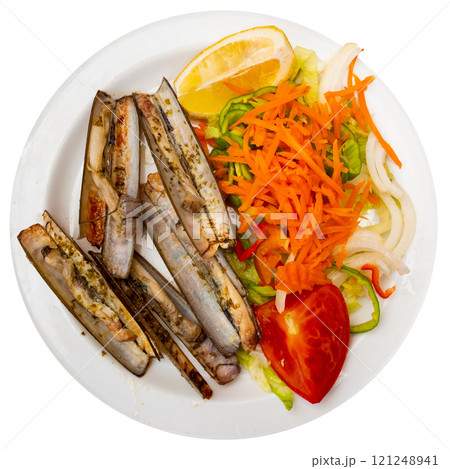 Baked razor clams with fresh vegetable salad and lemon Baked razor clams with fresh vegetable salad and lemon 121248941
