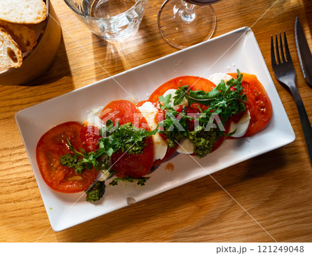 Caprese salad served with arugula Caprese salad served with arugula 121249048