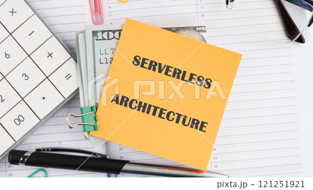 Concept words SERVERLESS ARCHITECTURE it is written on a sticker on the background of an open notebook 121251921
