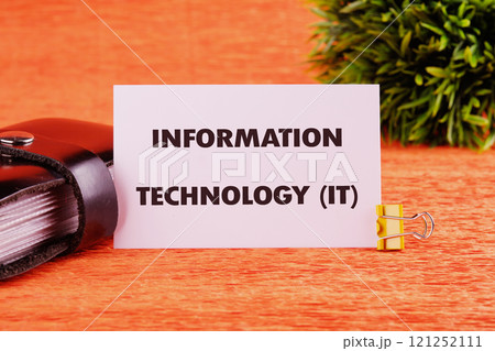 System Administration and Machine Learning Engineer Programming. Business and technology concept. The conceptual phrase INFORMATION TECHNOLOGY (IT) on a white business card close-up System Administration and Machine Learning Engineer Programming. Business and technology concept. The conceptual phrase INFORMATION TECHNOLOGY (IT) on a white business card close-up 121252111