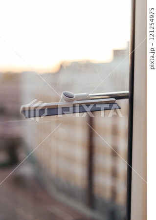 Window cleaning brush for windows. Washing windows with a window brush 121254975