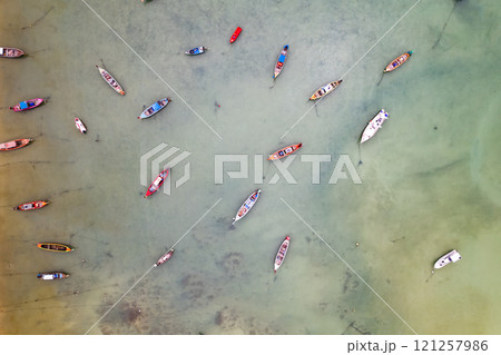 Aerial drone bird's eye view photo Top down of tropical sea with long tail fishing boats Travel boats at phuket thailand, Amazing top view sea nature landscape Aerial drone bird's eye view photo Top down of tropical sea with long tail fishing boats Travel boats at phuket thailand, Amazing top view sea nature landscape 121257986