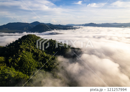 Amazing Sunrise or sunset over mountains hills covered with mist, Aerial view landscape drone shot beautiful colorful nature background Amazing Sunrise or sunset over mountains hills covered with mist, Aerial view landscape drone shot beautiful colorful nature background 121257994