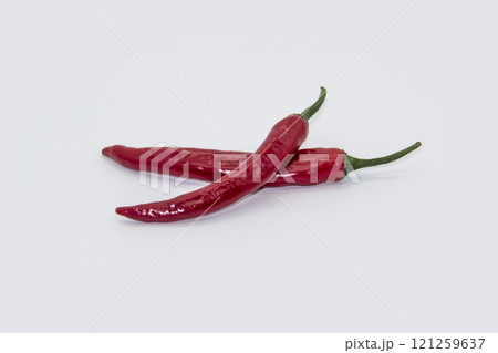 Two Chili peppers isolated on white background. Hot ripen chili peppers without GMO. Organic mexican spices 121259637
