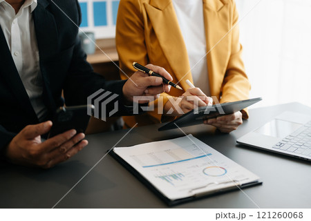 Business team meeting present.professional investor working with  Finance managers task. with laptop smart phone and tablet 121260068