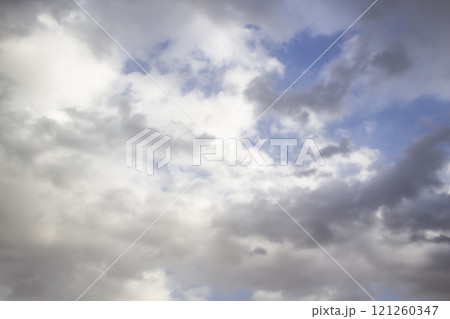 Clouds in the blue sky. A beautiful clouds against the blue sky background. Beautiful cloud pattern in the sky. 121260347
