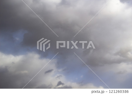 Clouds in the blue sky. A stunning gray sky. The storm is approaching. A beautiful clouds against the blue sky background. Amazing cloud pattern in the sky. Clouds in the blue sky. A stunning gray sky. The storm is approaching. A beautiful clouds against the blue sky background. Amazing cloud pattern in the sky. 121260386