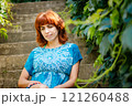 The girl with the red hair in the leaves 121260488