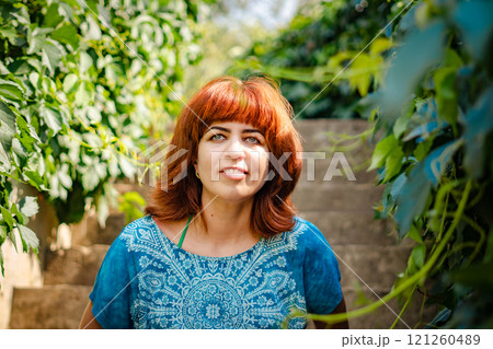 The girl with the red hair in the leaves 121260489