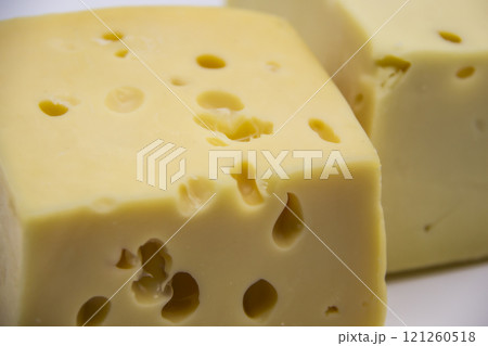 Delicious fresh hard cheese on a white background. Healty and very tasty cheese. Delicious fresh hard cheese on a white background. Healty and very tasty cheese. 121260518