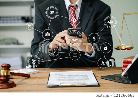justice and law concept. Male judge in a courtroom the gavel, working with smart phone and laptop and digital tablet justice and law concept. Male judge in a courtroom the gavel, working with smart phone and laptop and digital tablet 121260663