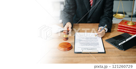 Justice and law concept.Male judge in a courtroom on white table and Counselor or Male lawyer working 121260729