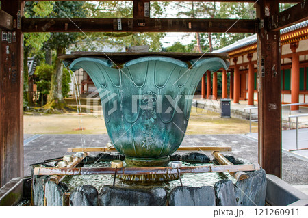 Water fountain in Yakushi-ji, one of the most famous ancient Buddhist temples in Japan, built in 680 AD in Nara, Japan Water fountain in Yakushi-ji, one of the most famous ancient Buddhist temples in Japan, built in 680 AD in Nara, Japan 121260911