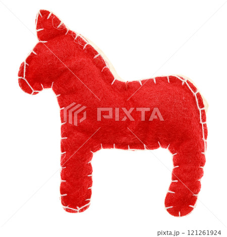 Handmade red felt horse toy with white stitching details isolated on white background Handmade red felt horse toy with white stitching details isolated on white background 121261924