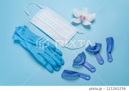 Latex gloves, a medical mask and dental pliant impression trays. Latex gloves, a medical mask and dental pliant impression trays. 121262256