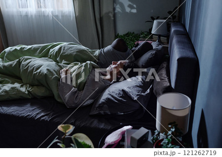 High angle shot of unrecognizable wife and husband sleeping easy in comfortable bed 121262719