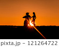 Silhouette of a girl and a man on a motorcycle.  121264722