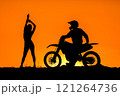 Silhouette of a girl and a man on a motorcycle.  121264736