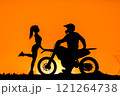 Silhouette of a girl and a man on a motorcycle.  121264738