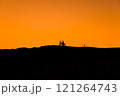 Silhouette of a girl and a man on a motorcycle.  121264743