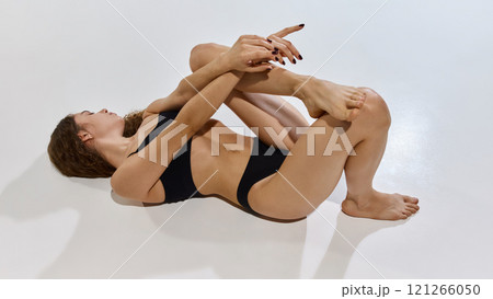 Artistic pose radiates self-confidence, celebrating body awareness and natural curves with elegant gestures symbolizing inner strength and grace. Artistic pose radiates self-confidence, celebrating body awareness and natural curves with elegant gestures symbolizing inner strength and grace. 121266050