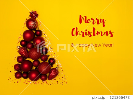 Christmas tree design with red ornaments on yellow background Christmas tree design with red ornaments on yellow background 121266478